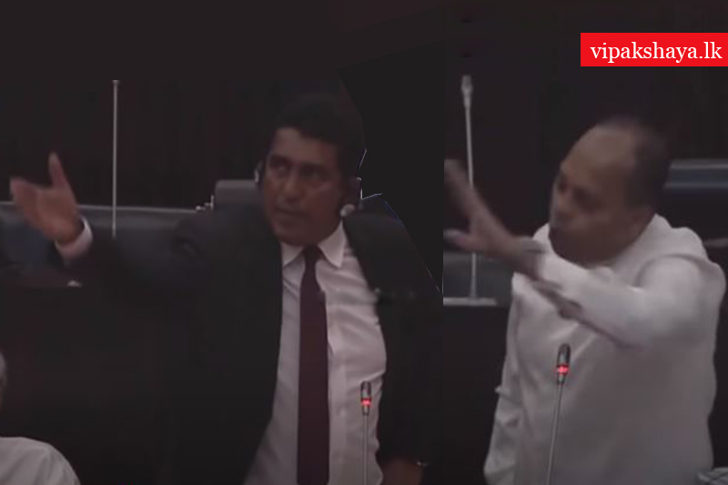 පාර්ලිමේන්තුවේ පුටු කඩලා බයිබල් පොළොවේ ගහපු මිනිස්සු ශාන්තුවරු වෙන්න හදනවා - මරික්කාර් ජොන්ස්ටන් පැටලෙයි (VIDEO)